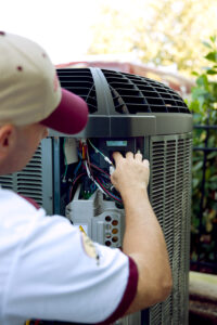 technician repairing AC