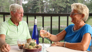 customers relax on lanai with wine